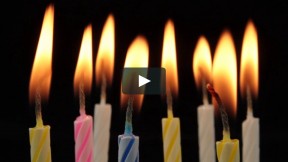 Flames on Colorful Birthday Cake Candles